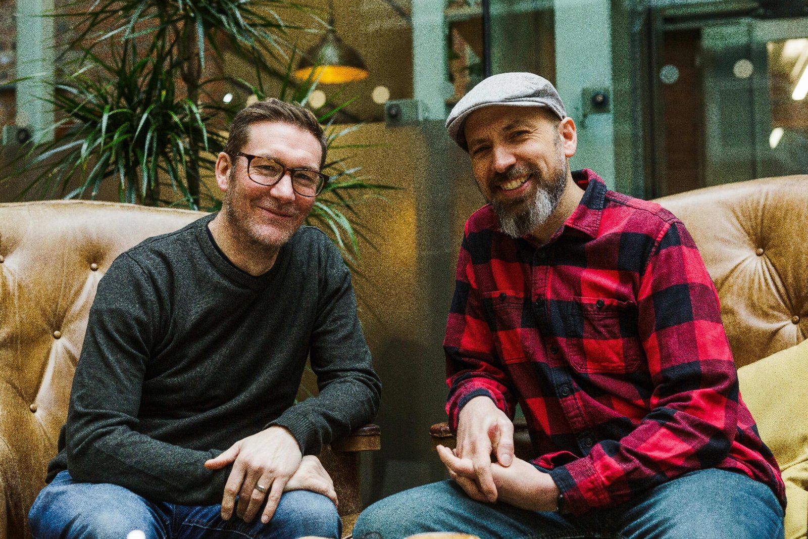 James and Garry relaxed on a sofa